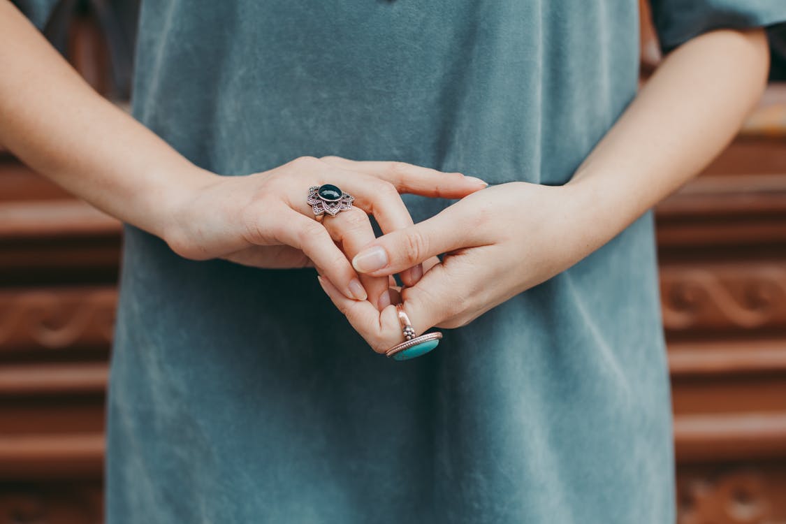 Close up of woman's hands wearing rings