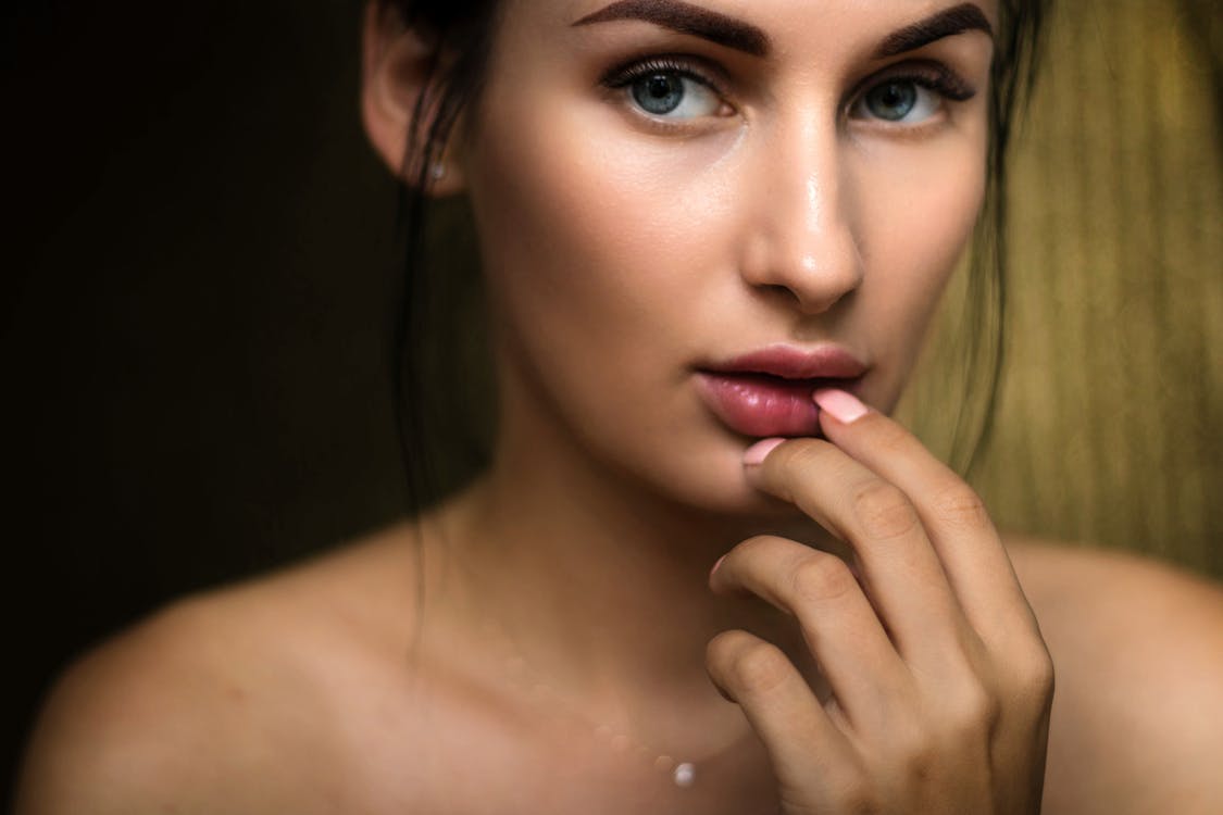 Close up of woman touching her lips