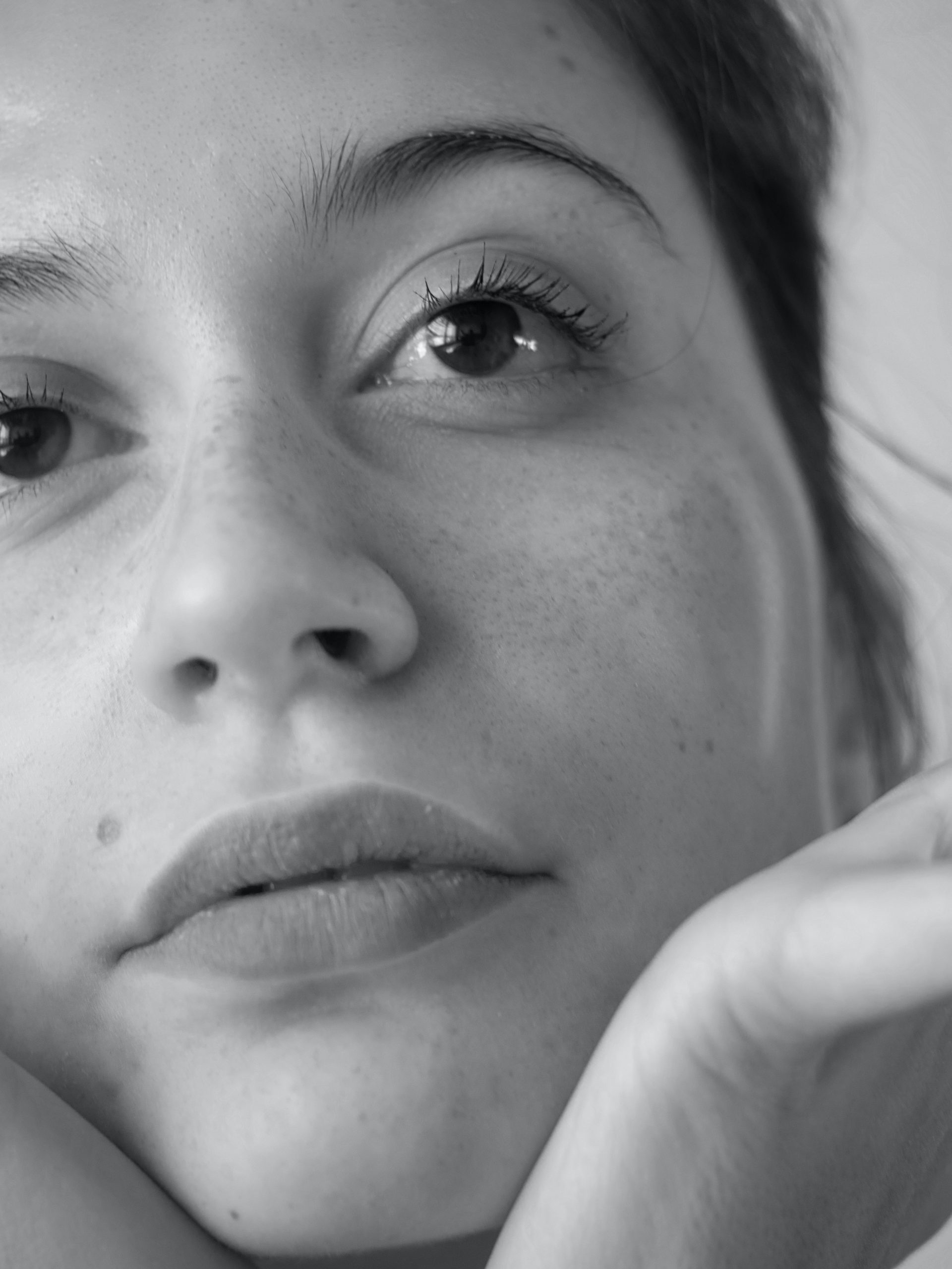 Close up black and white photo of a woman's face