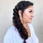 woman getting hair braided and styled