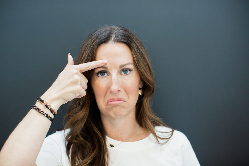 Customer pointing to wrinkles on forehead