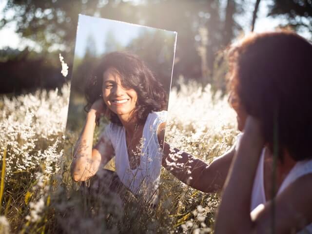 person looking at reflection